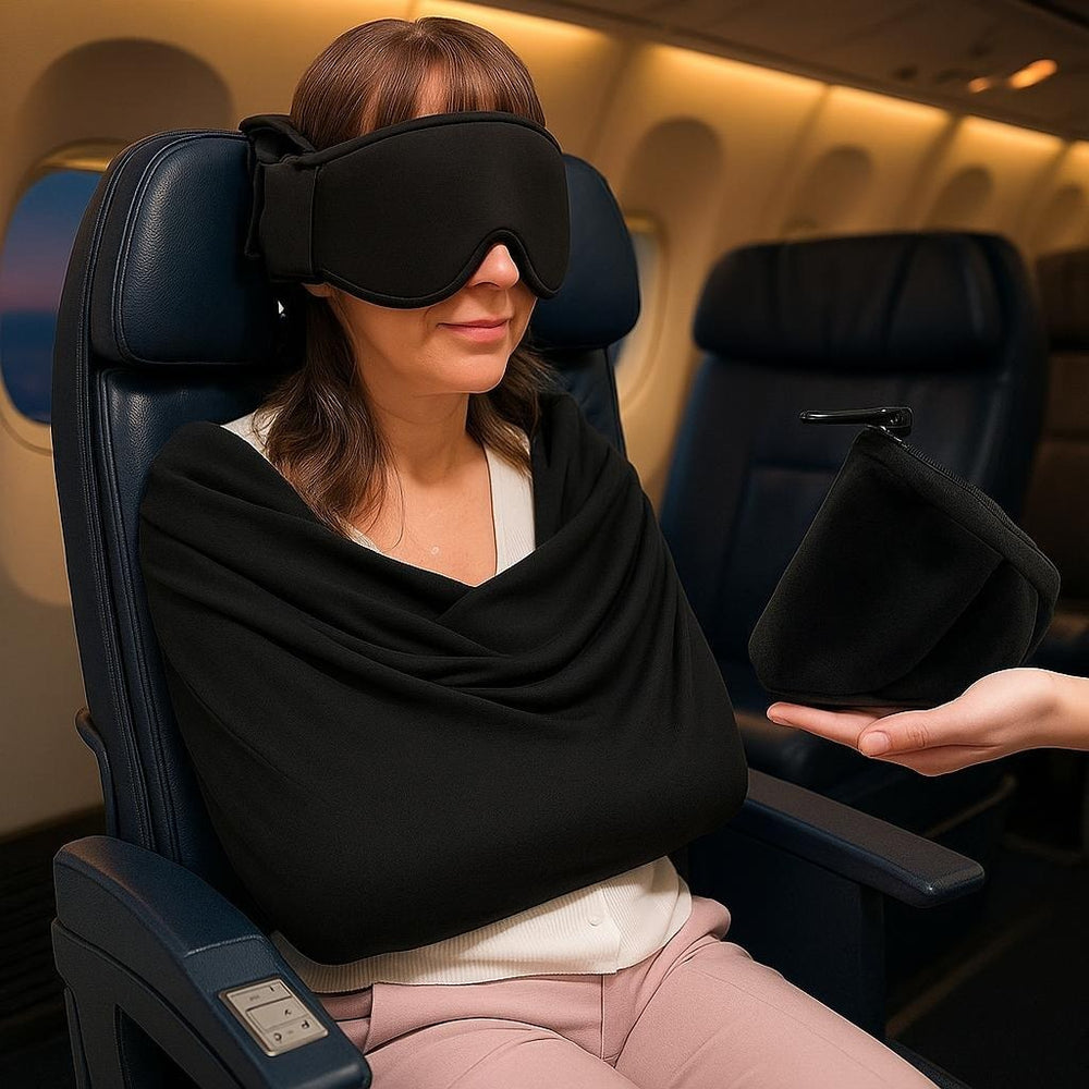 Traveler asleep upright in an airplane seat wearing the Snoozeat sleep set